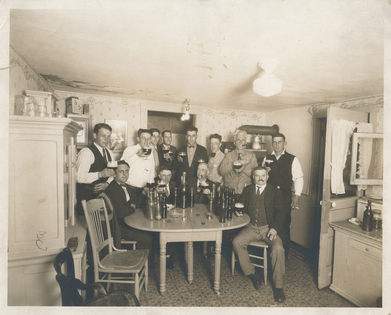 Photograph of Men Drinking at a Table